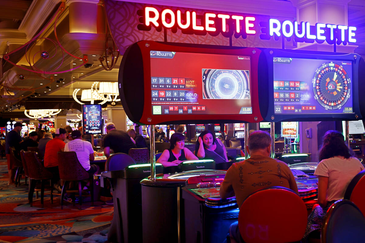 Sharon McLachlan of Vancouver, left, and her daughter Stacey play electronic table games at the ...