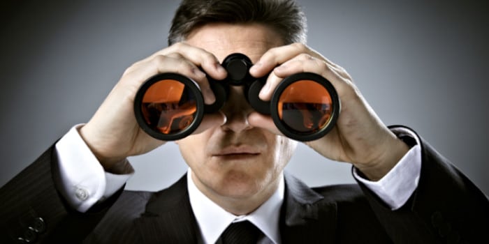 news-a-businessman-looking-through-binoculars