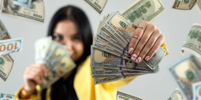 news-woman-holding-money-us-dollars