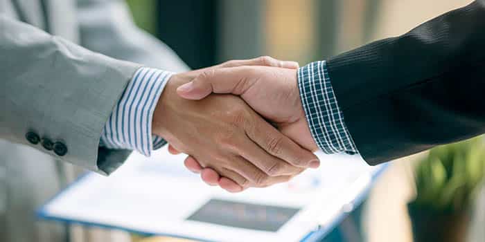 businessmen-shake-hands-deal-agreement-news