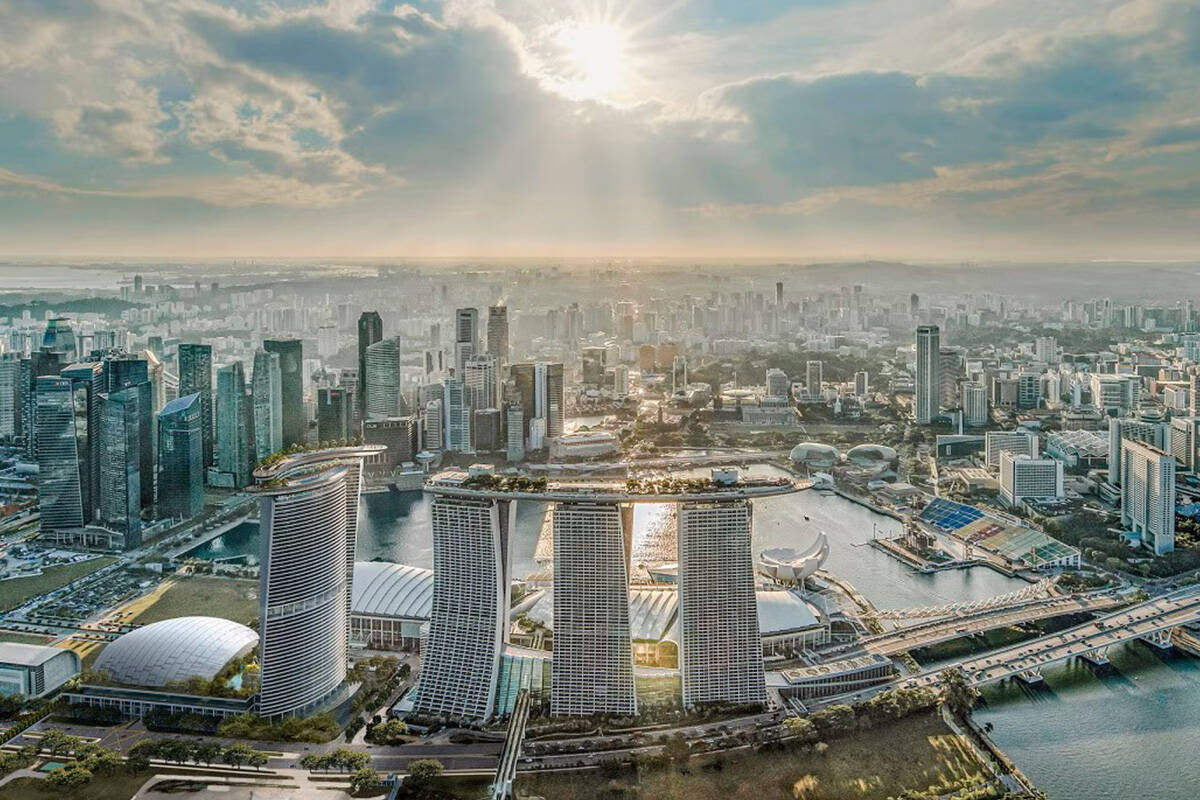 Here’s a rendering of how the Marina Bay Sands will look after the completion of a new 1,000- ...